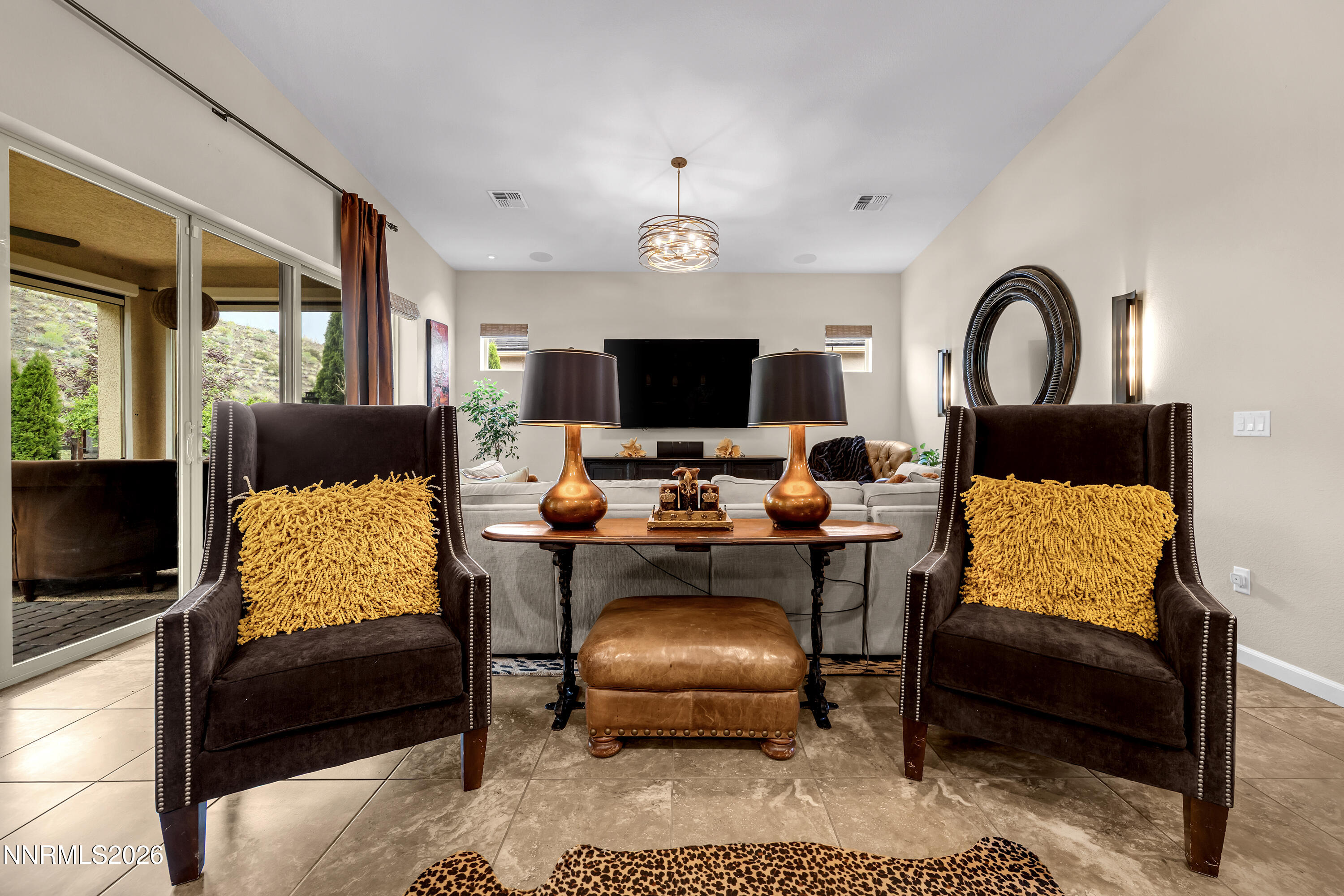9021 Iron Sky Court Reno, NV 89523 - Photo 13 of 39 a living room with furniture a flat screen tv and a window