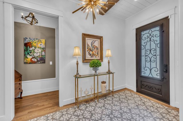 a living room with fireplace furniture and a flat screen tv