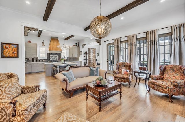 a kitchen with stainless steel appliances granite countertop a sink a stove and cabinets