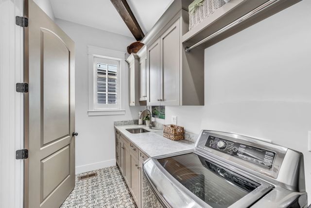 a view of walk in closet with clothes