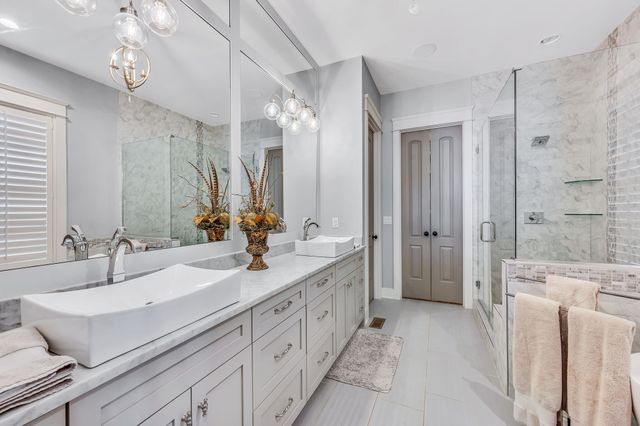 a view of a hallway with wooden floor and furniture