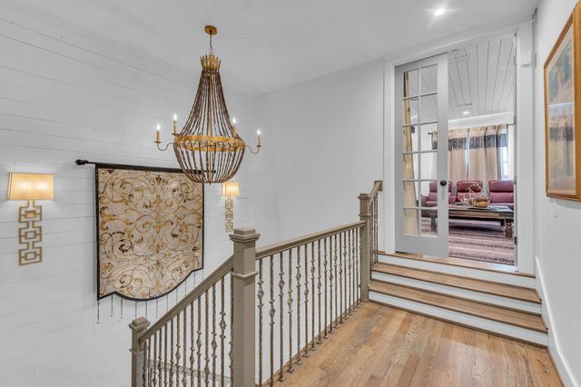 a bathroom with a bath tub with a shower