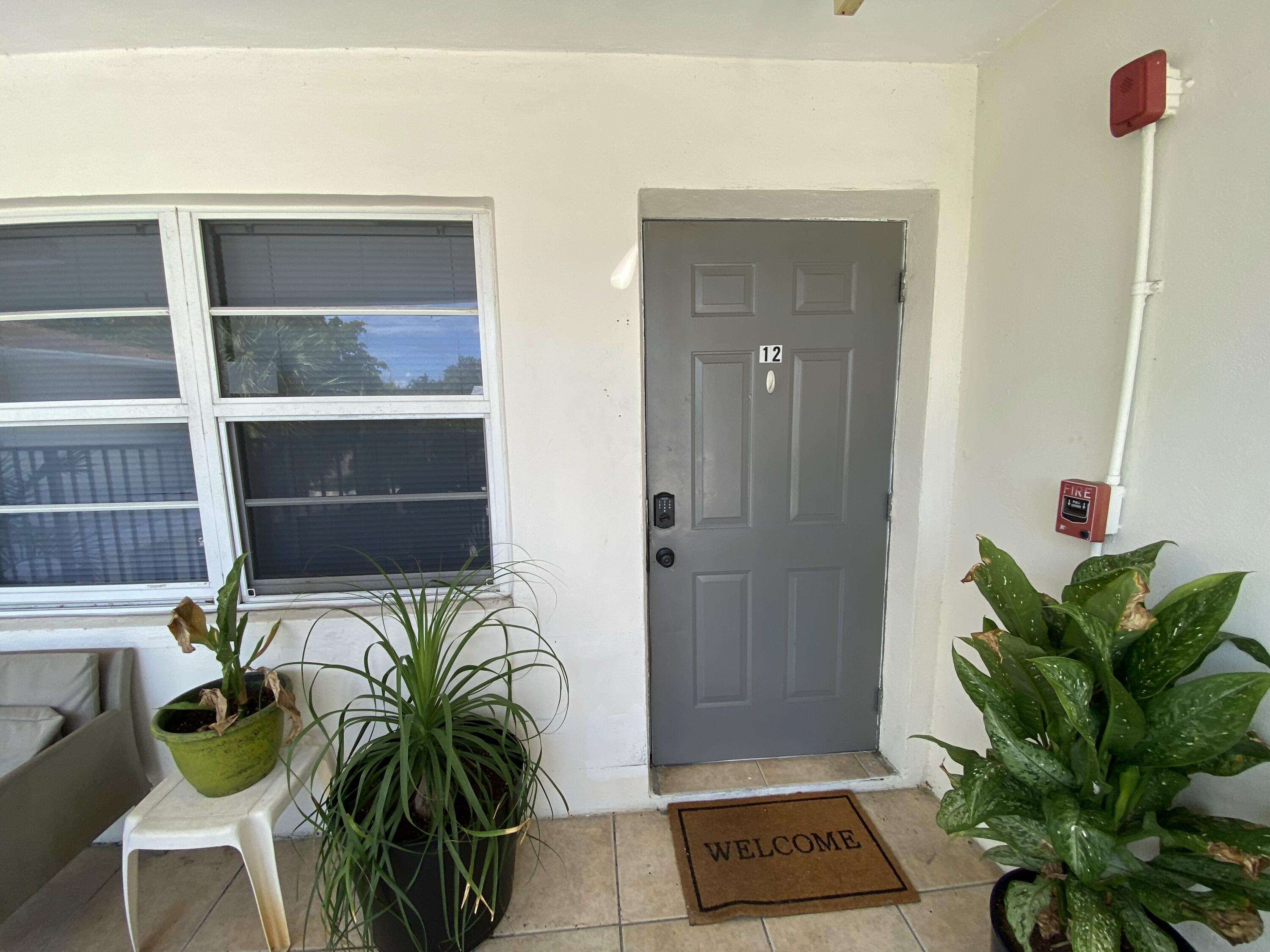a view of a entryway with flower pots