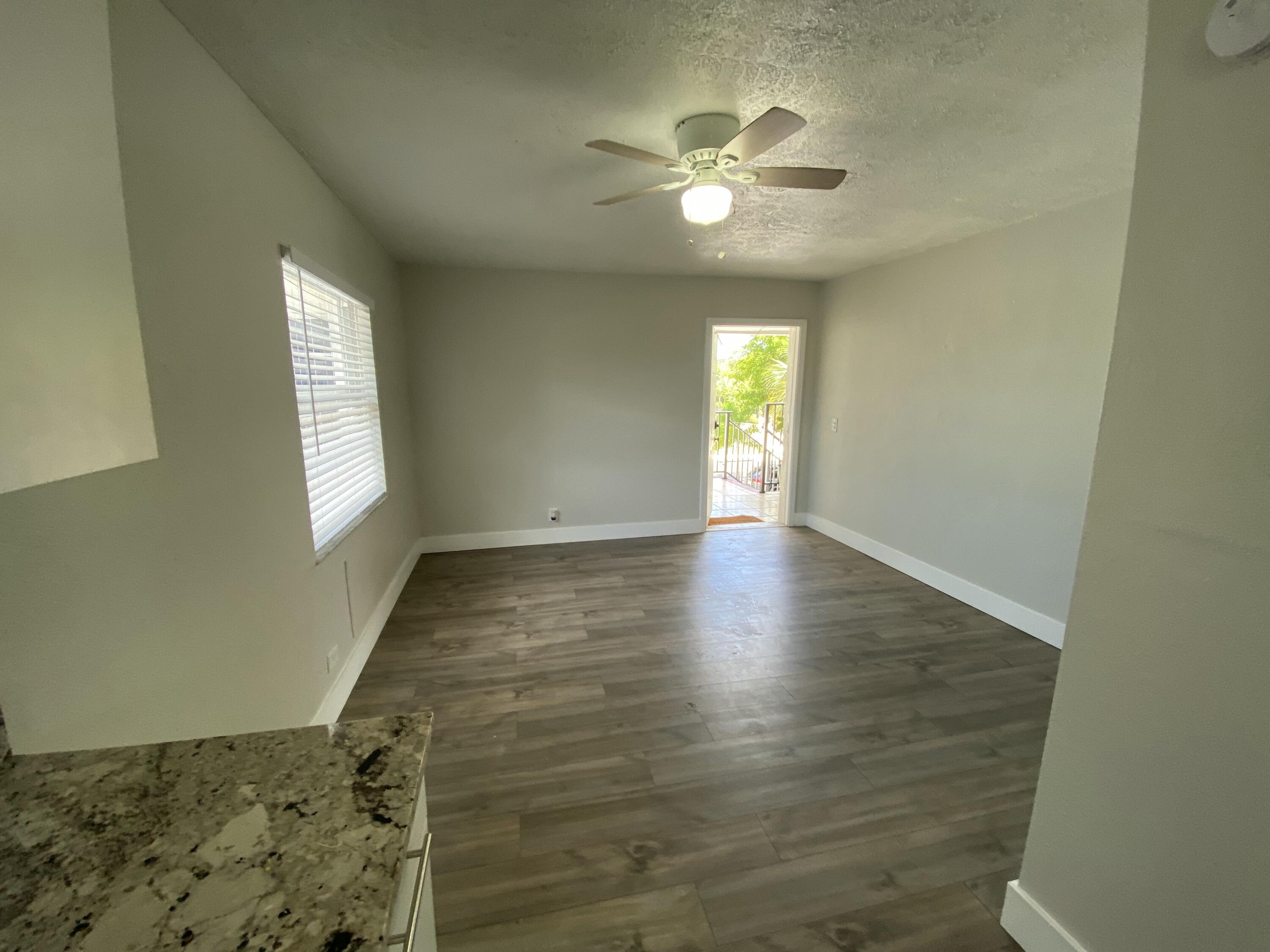 605 North Federal Highway, Unit 12 Lake Worth Beach, FL 33460 - Photo 8 of 9 wooden floor in an empty room with a window