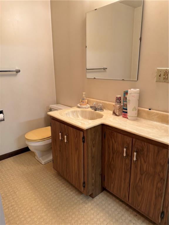 766 North Pike Road Cabot, PA 16023 - Photo 11 of 11 a bathroom with a granite countertop sink a large mirror and toilet