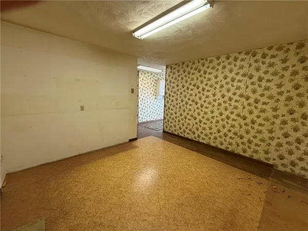 a large kitchen with stainless steel appliances granite countertop a stove granite counter tops and white cabinets