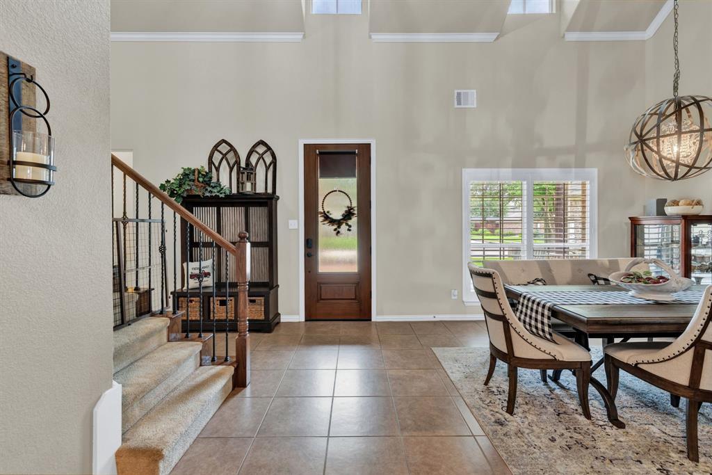 1701 Meadow Ranch Road McKinney, TX 75071 - Photo 4 of 40 a view of a dining room with furniture and a window