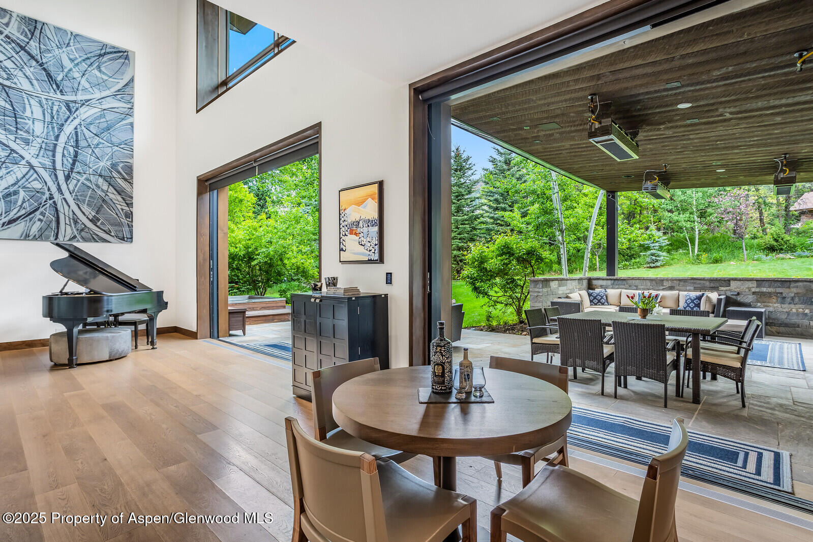 130 Primrose Path Aspen, CO 81611 - Photo 11 of 94 a view of a patio with a dining table and chairs