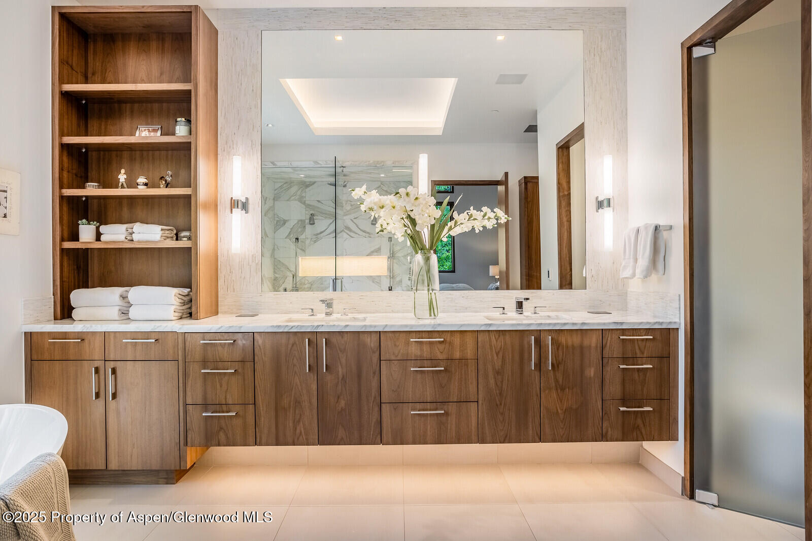 130 Primrose Path Aspen, CO 81611 - Photo 23 of 94 a spacious bathroom with a granite countertop sink and a mirror