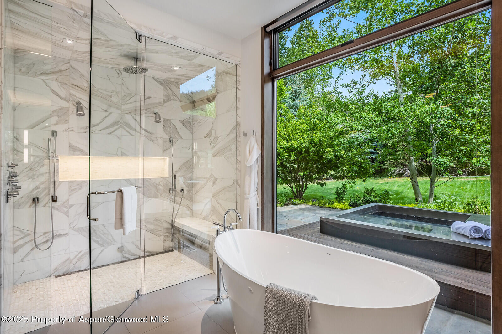 130 Primrose Path Aspen, CO 81611 - Photo 25 of 94 a living room with large trees and a potted plant