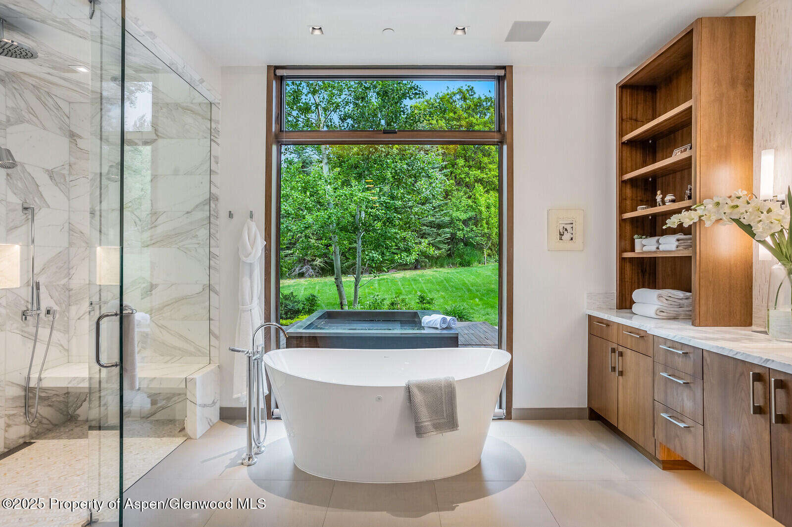 130 Primrose Path Aspen, CO 81611 - Photo 26 of 94 a living room with a large window and a wooden floor