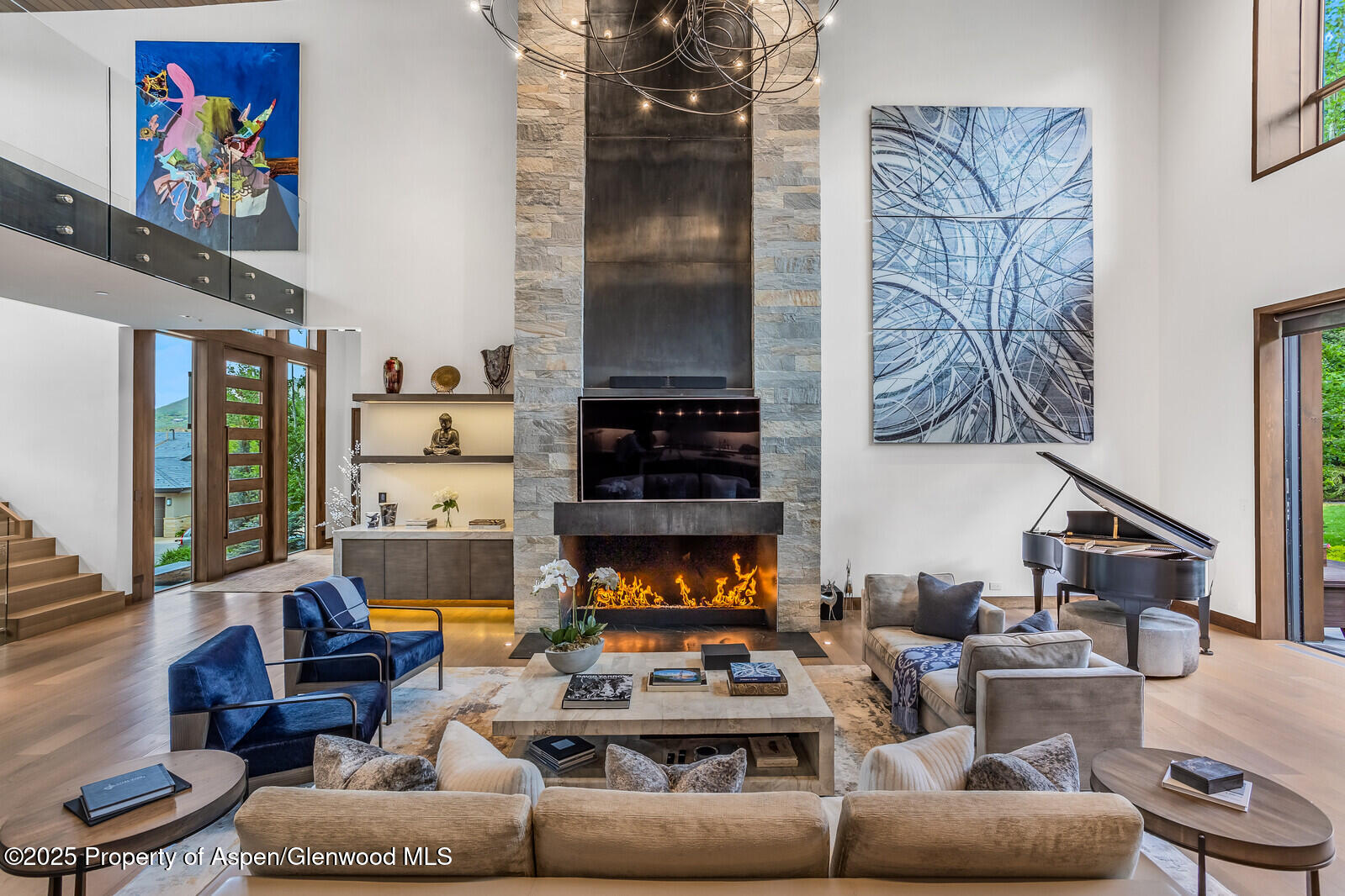 130 Primrose Path Aspen, CO 81611 - Photo 3 of 94 a living room with furniture a fireplace and a flat screen tv