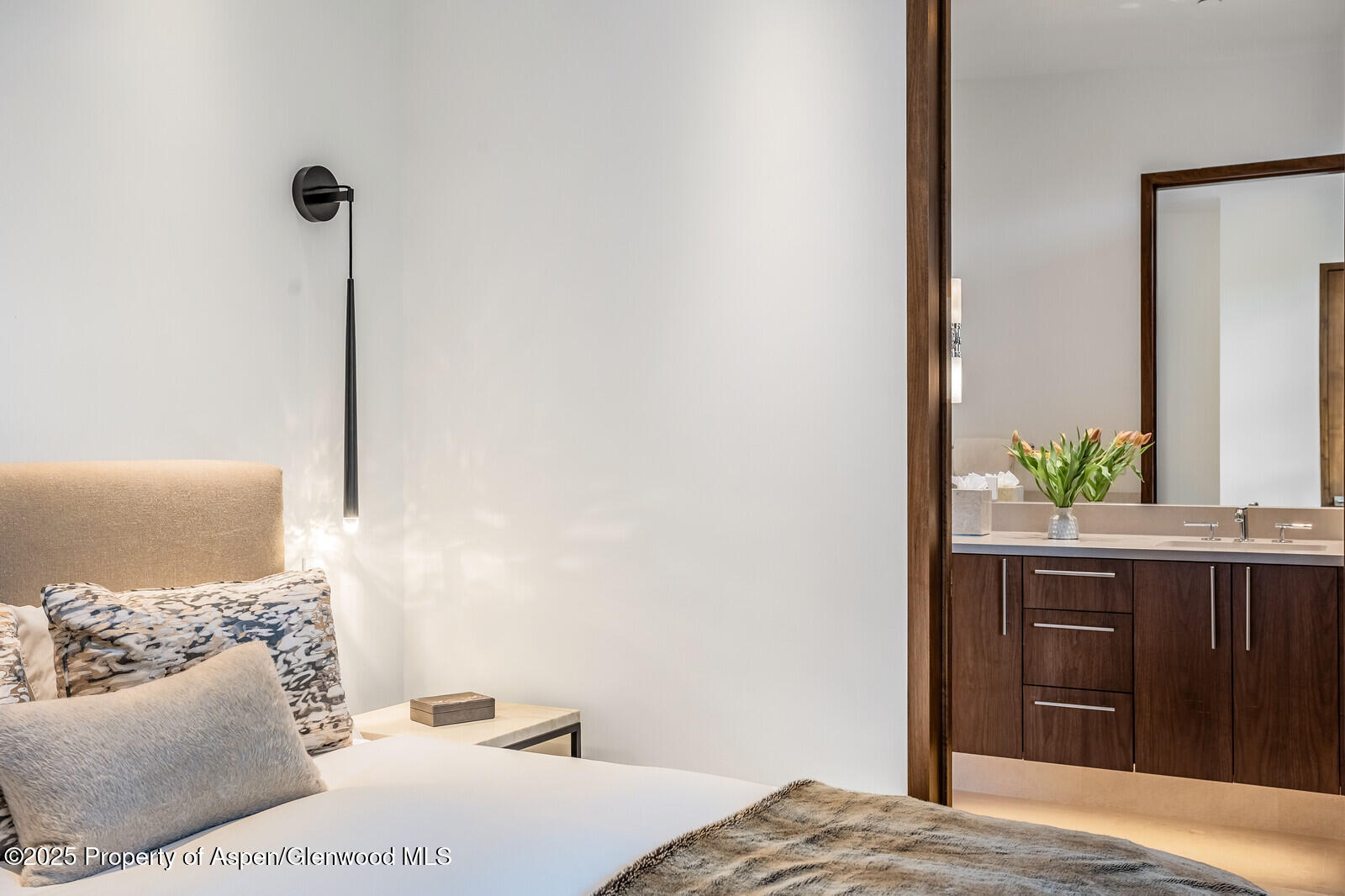 130 Primrose Path Aspen, CO 81611 - Photo 32 of 94 a bedroom with a bed and a cabinets