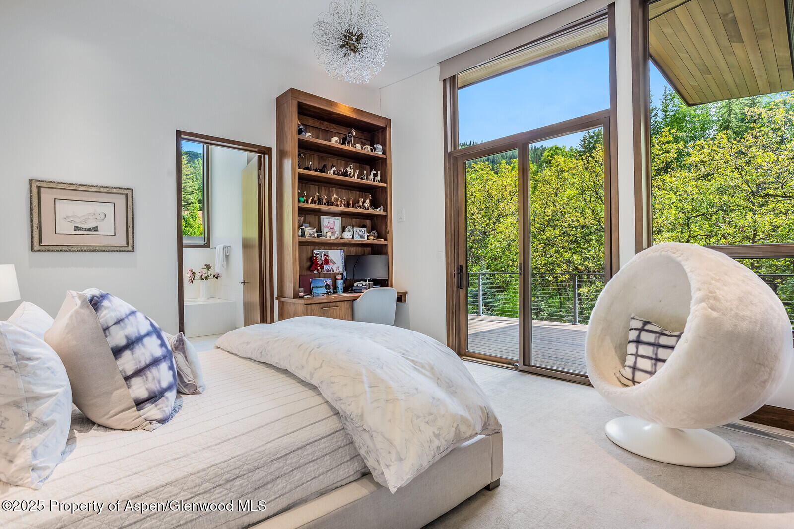 130 Primrose Path Aspen, CO 81611 - Photo 34 of 94 a bed sitting in a bedroom next to a window