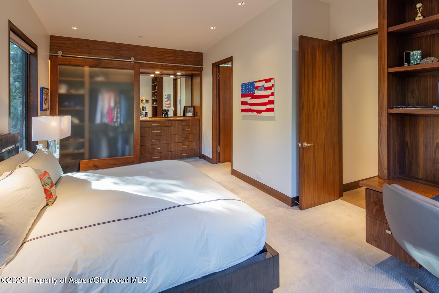 130 Primrose Path Aspen, CO 81611 - Photo 38 of 94 a bedroom with a bed and a refrigerator