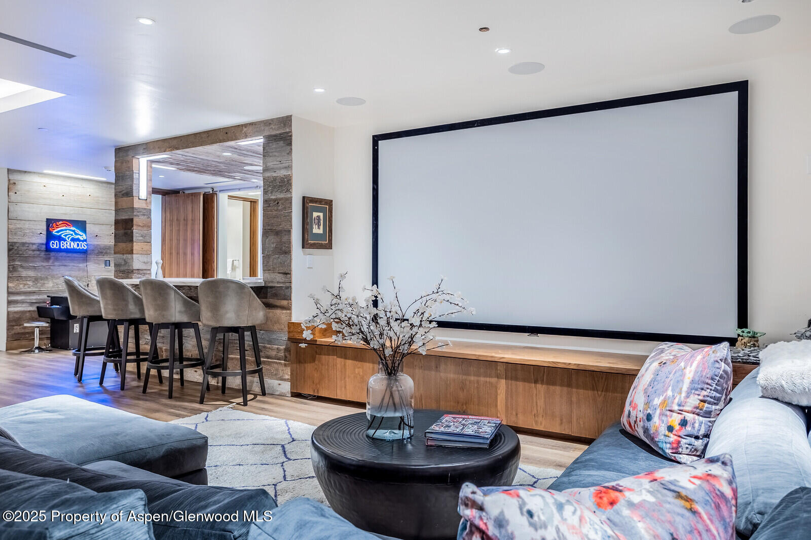 130 Primrose Path Aspen, CO 81611 - Photo 45 of 94 a living room with furniture and a chandelier