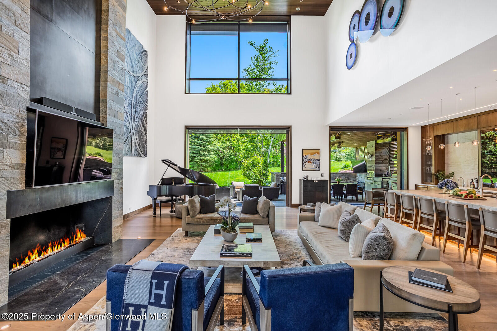 130 Primrose Path Aspen, CO 81611 - Photo 6 of 94 a living room with furniture fireplace and a flat screen tv