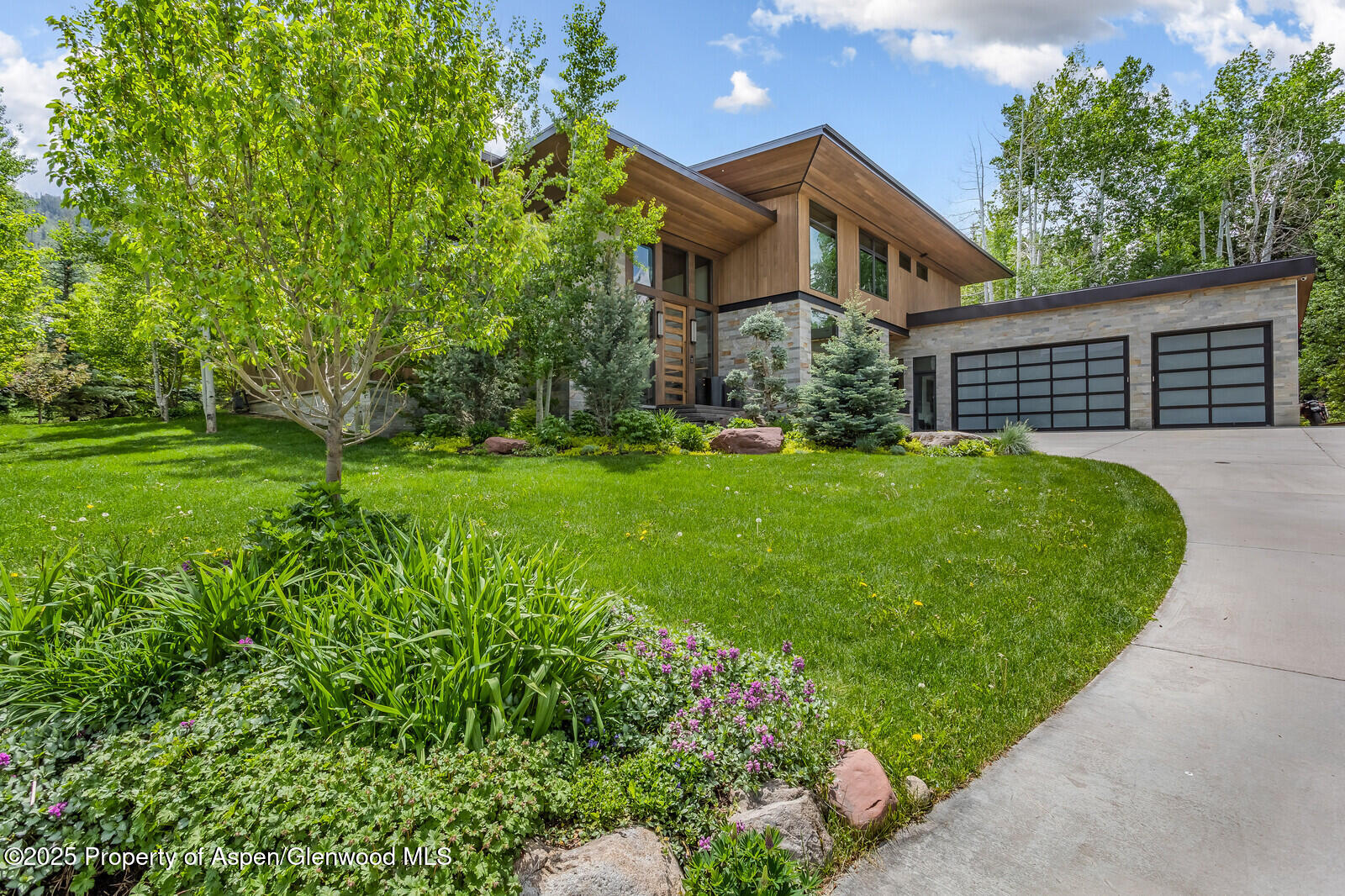 130 Primrose Path Aspen, CO 81611 - Photo 68 of 94 a front view of a house with a yard