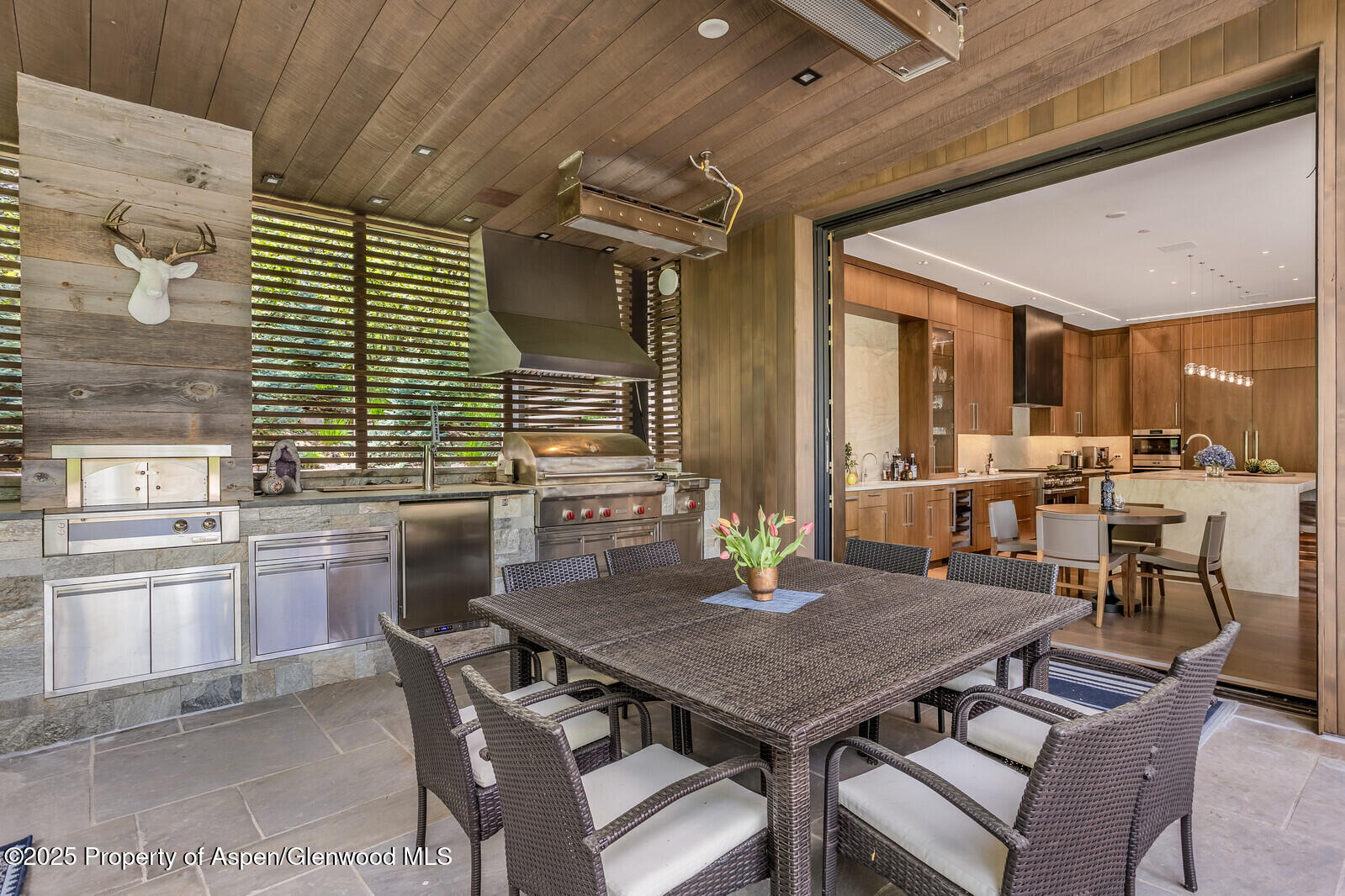 130 Primrose Path Aspen, CO 81611 - Photo 80 of 94 a view of a dining table and chairs in the patio