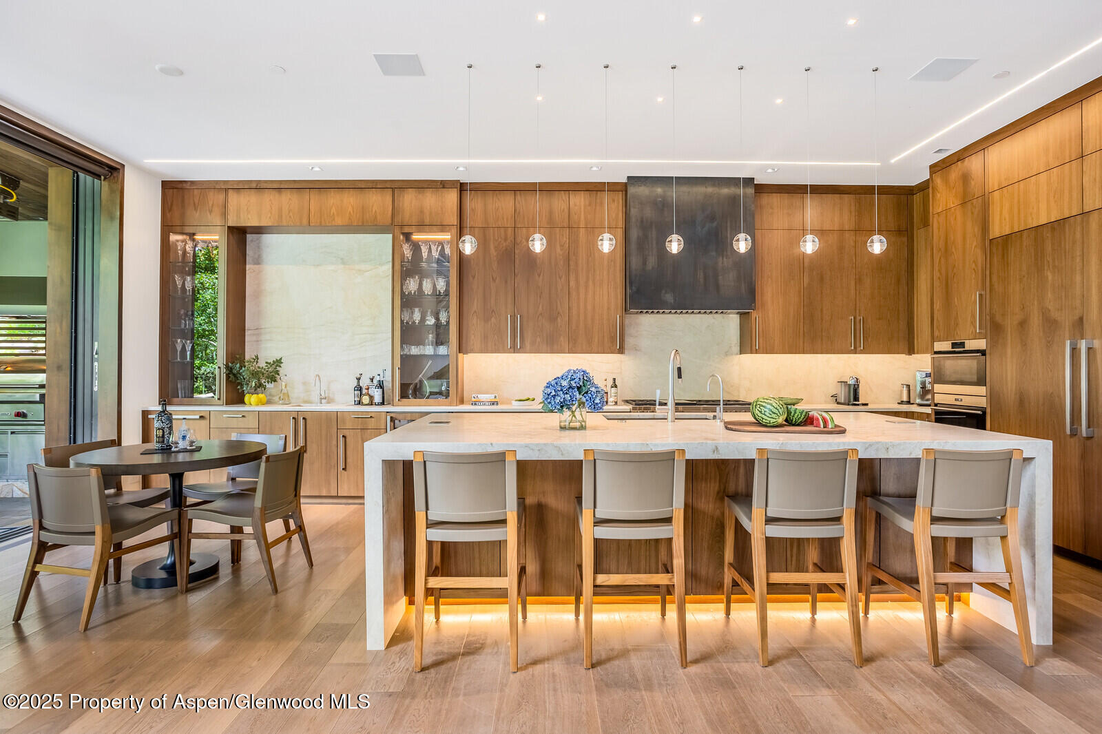 130 Primrose Path Aspen, CO 81611 - Photo 8 of 94 a large dining hall with stainless steel appliances granite countertop a table and chairs in it