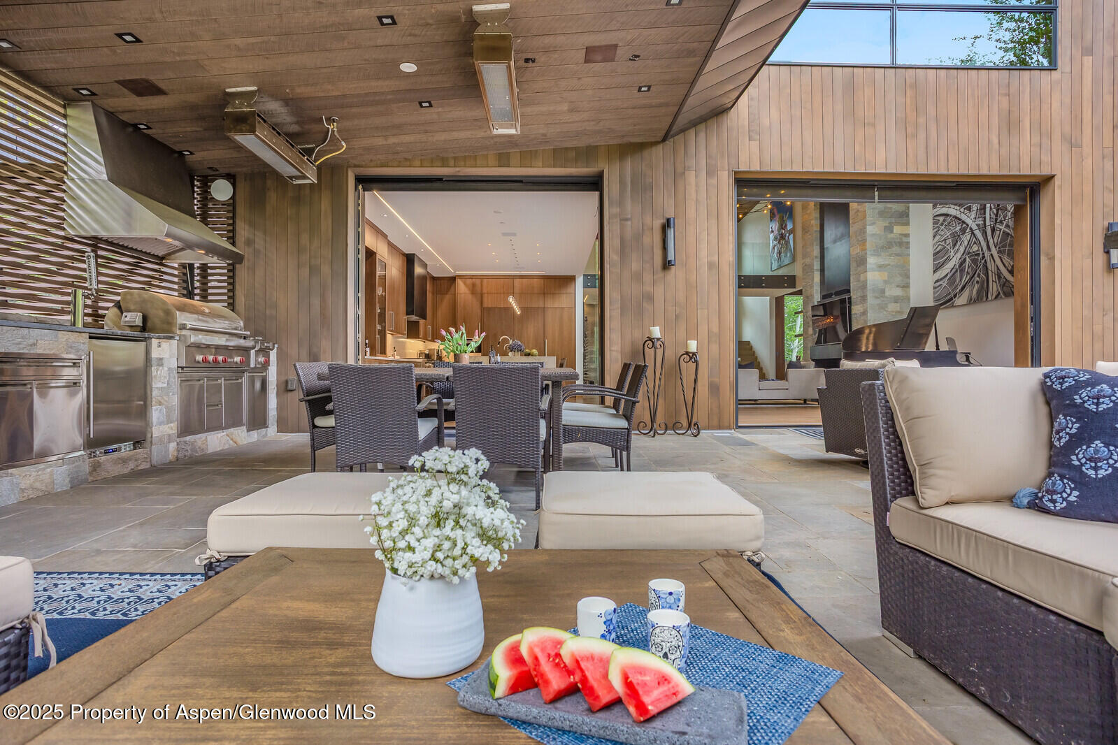 130 Primrose Path Aspen, CO 81611 - Photo 82 of 94 a living room with furniture chandelier and wooden floor