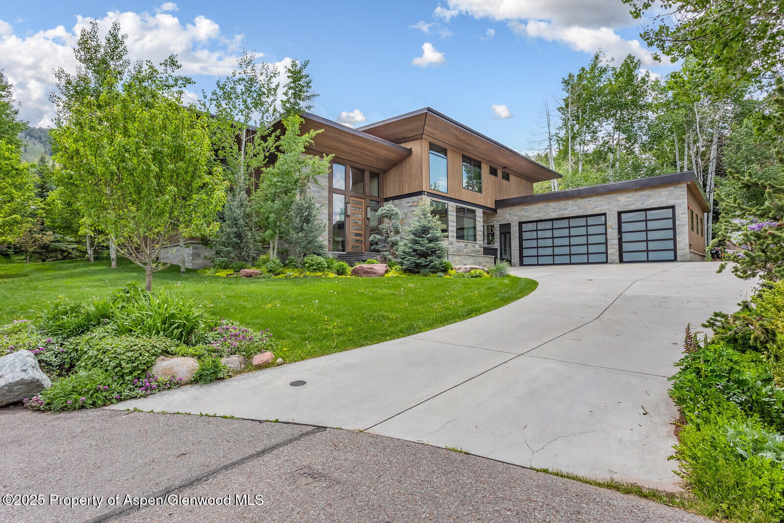 130 Primrose Path Aspen, CO 81611 - Photo 86 of 94 a front view of a house with a yard