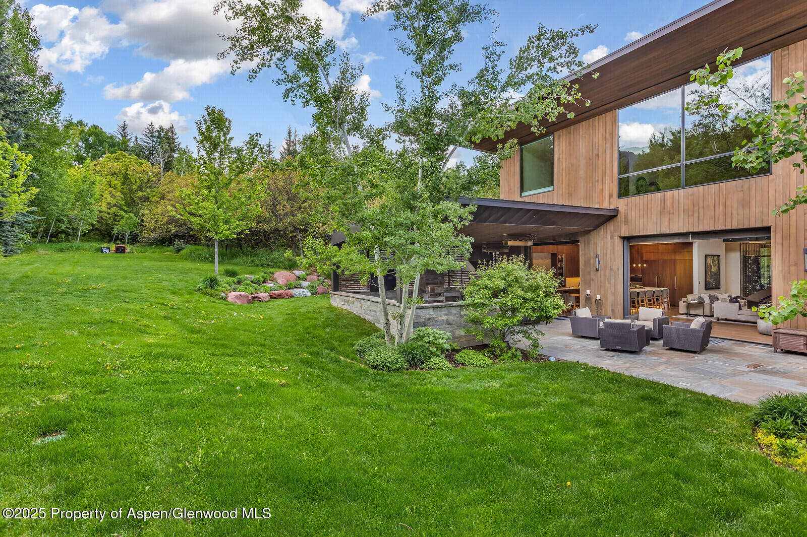 130 Primrose Path Aspen, CO 81611 - Photo 89 of 94 a view of a house with a yard porch and sitting area