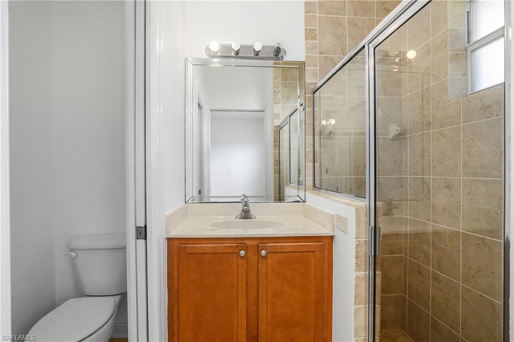 2119 River Ridge Boulevard Fort Myers, FL 33905 - Photo 13 of 19 Main Bath- featuring vanity, toilet, and walk in shower