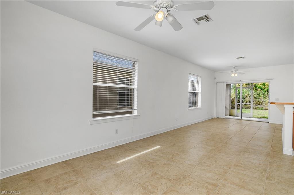 2119 River Ridge Boulevard Fort Myers, FL 33905 - Photo 6 of 19 Great room with ceiling fan and screened lanai at the rear.