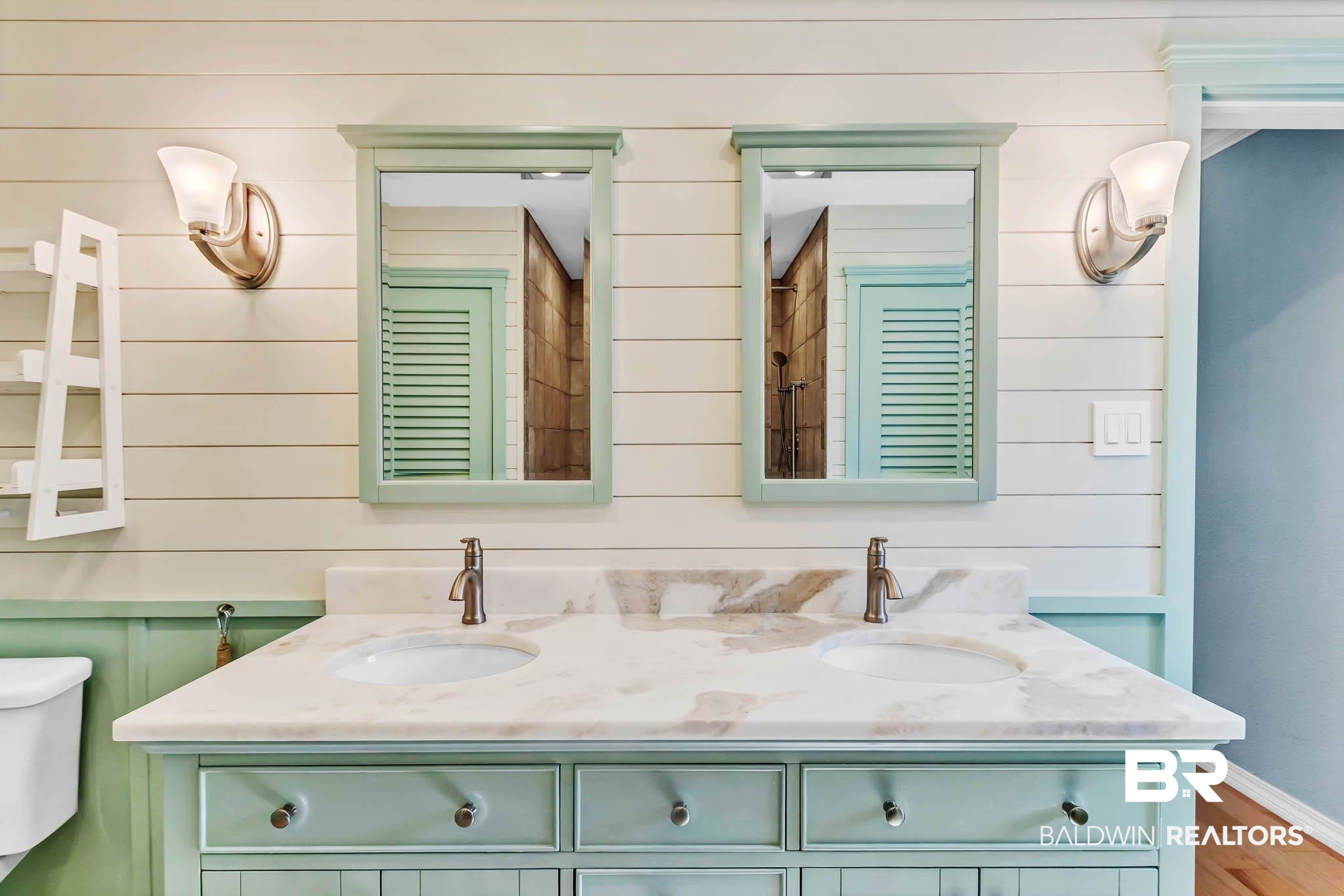 9607 Czar Court Fairhope, AL 36532 - Photo 21 of 42 Bathroom featuring double vanity, wooden walls, and wood finished floors