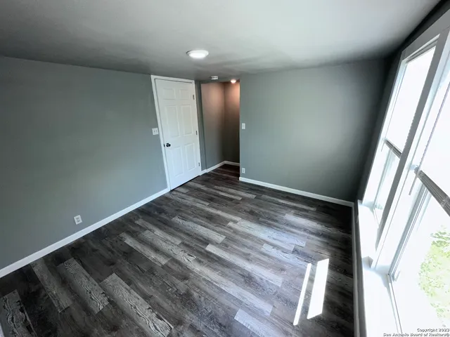 a view of an empty room and window