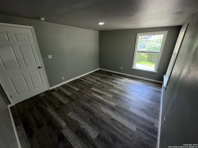 a view of an empty room and window