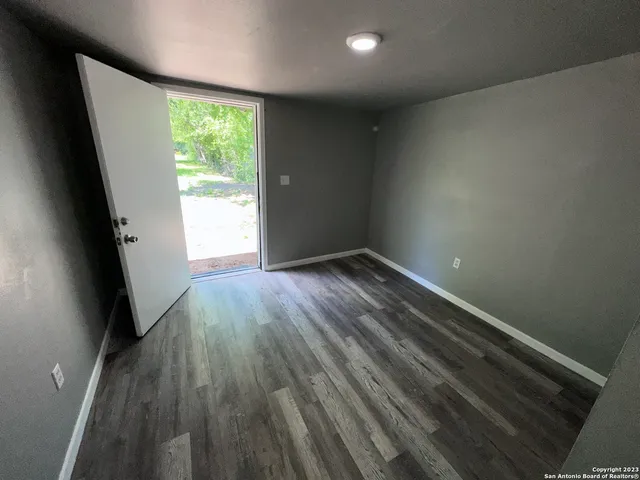 a view of room with window and hardwood floor