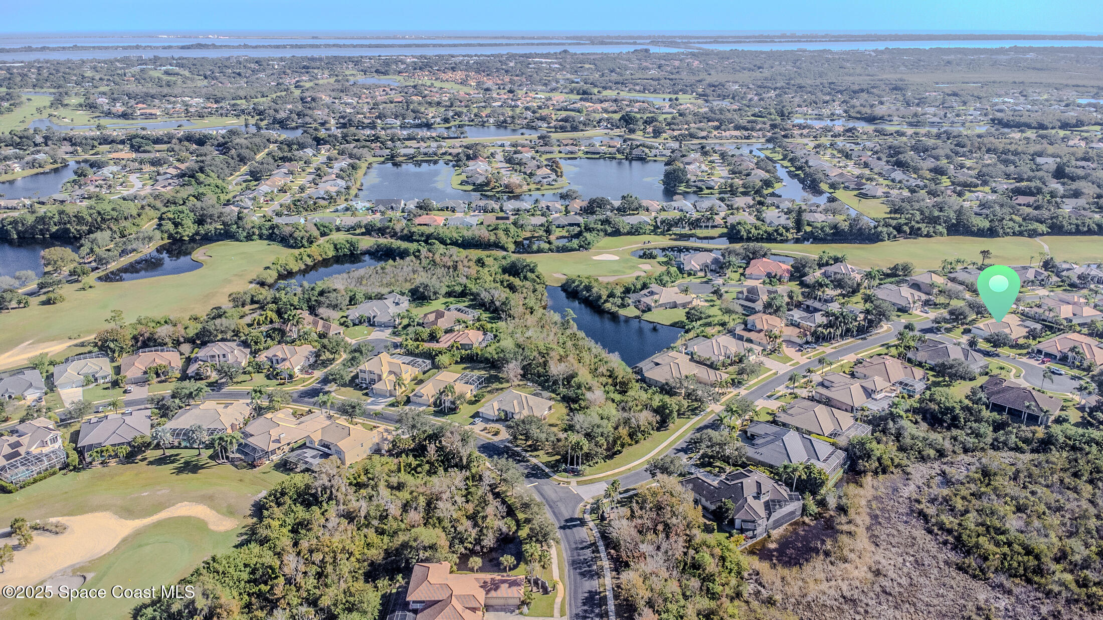 8201 Compton Way Melbourne, FL 32940 - Photo 48 of 52 an aerial view of a houses with a lake view