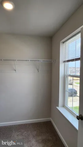 a view of a room that has a window in it