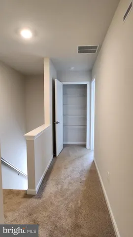 a view of an empty room and closet