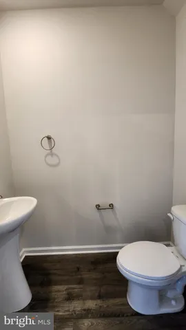 a bathroom with a toilet and a sink
