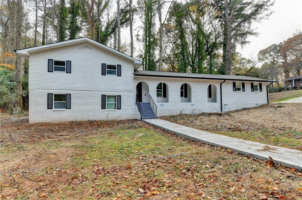 5169 Oxbow Road Stone Mountain, GA 30087 - Photo 2 of 58 a view of a house with a yard