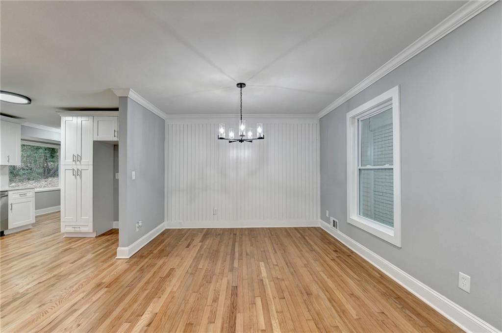 5169 Oxbow Road Stone Mountain, GA 30087 - Photo 21 of 58 a view of a room with wooden floor and windows