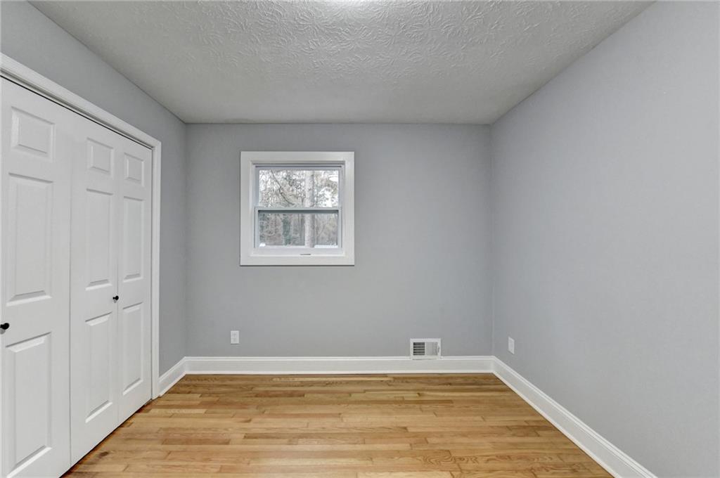 5169 Oxbow Road Stone Mountain, GA 30087 - Photo 27 of 58 a view of empty room with wooden floor
