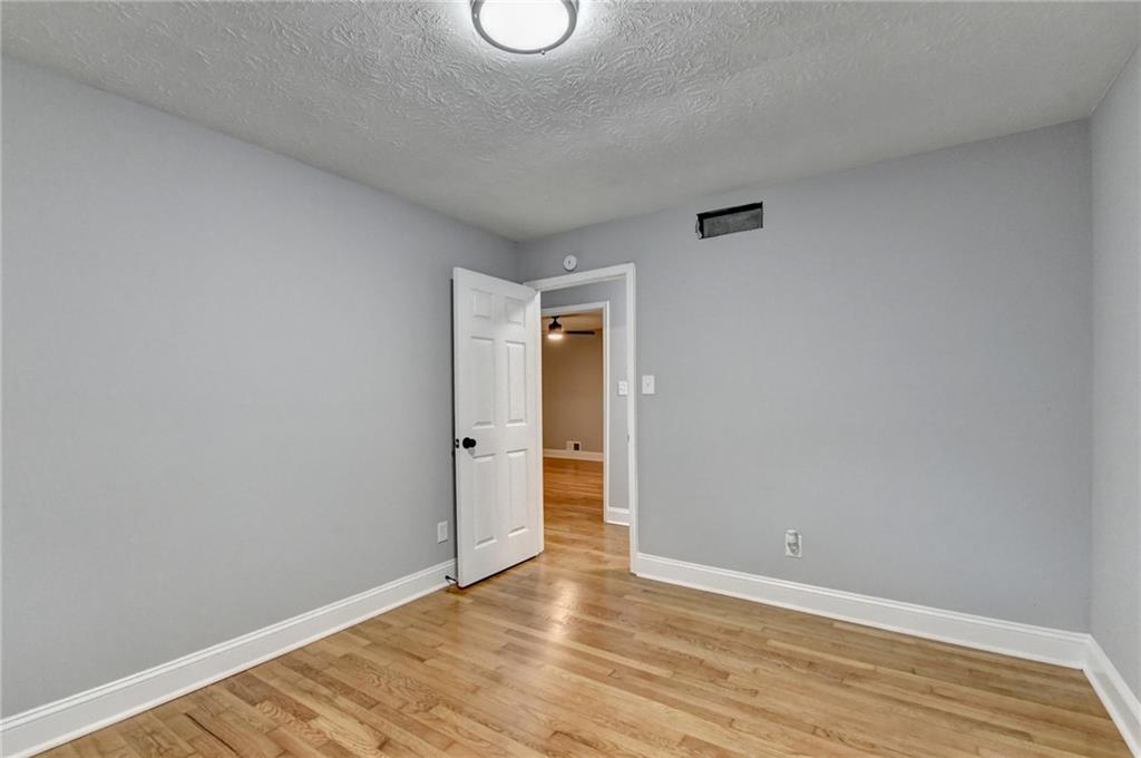 5169 Oxbow Road Stone Mountain, GA 30087 - Photo 28 of 58 a view of an empty room with wooden floor and closet
