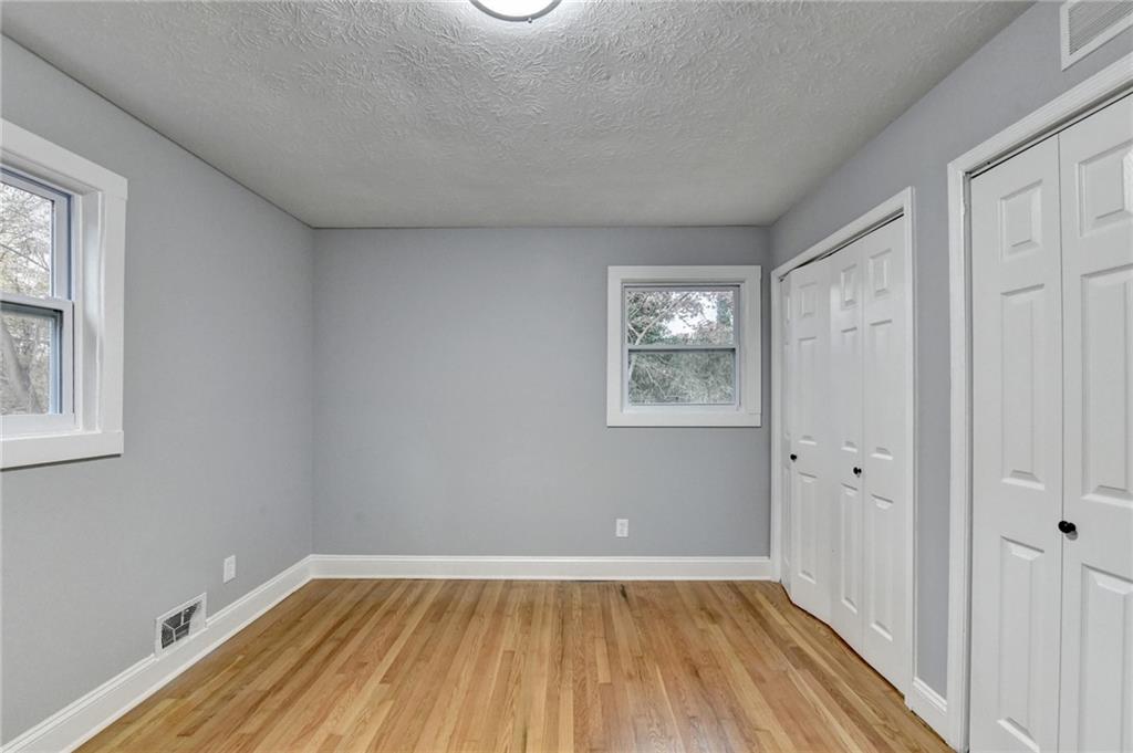 5169 Oxbow Road Stone Mountain, GA 30087 - Photo 33 of 58 an empty room with windows