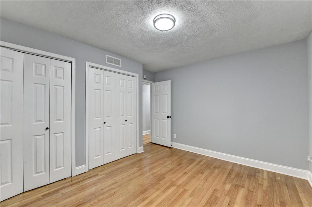 5169 Oxbow Road Stone Mountain, GA 30087 - Photo 34 of 58 a view of an empty room with wooden floor