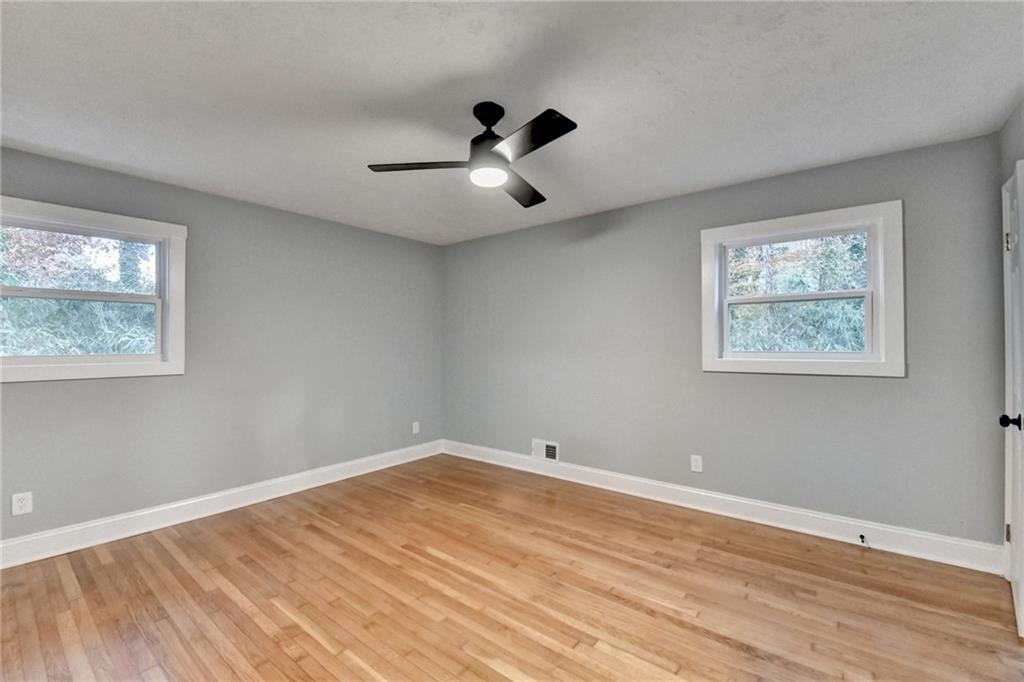 5169 Oxbow Road Stone Mountain, GA 30087 - Photo 36 of 58 a view of empty room with wooden floor