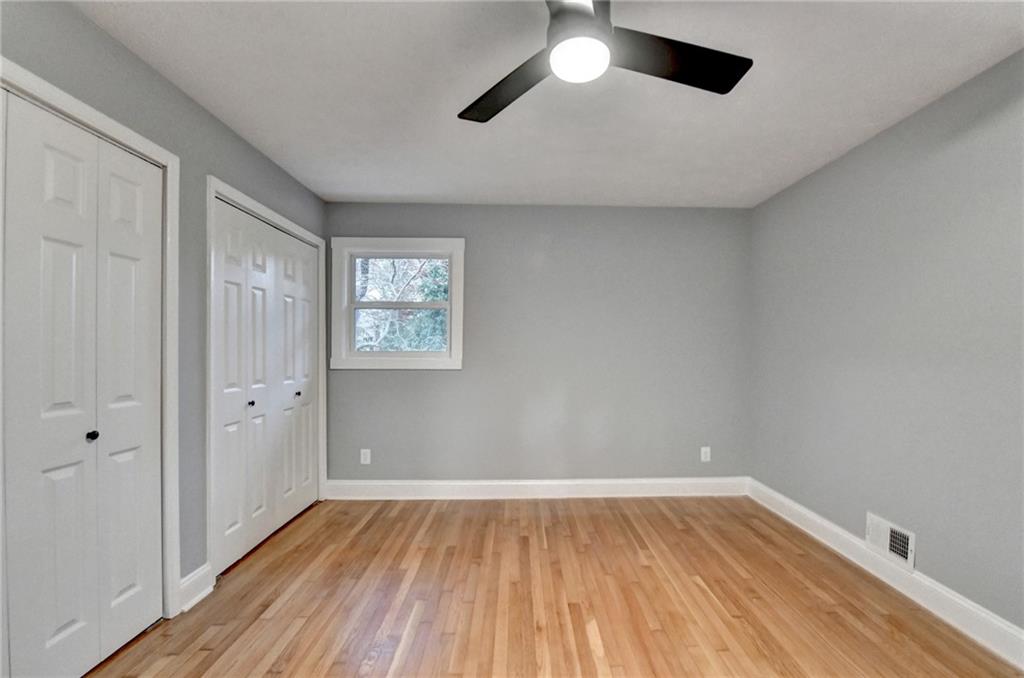 5169 Oxbow Road Stone Mountain, GA 30087 - Photo 37 of 58 wooden floor in an empty room with a window