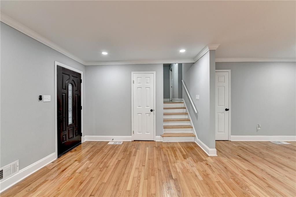 5169 Oxbow Road Stone Mountain, GA 30087 - Photo 4 of 58 a view of a room with wooden floor and stairs
