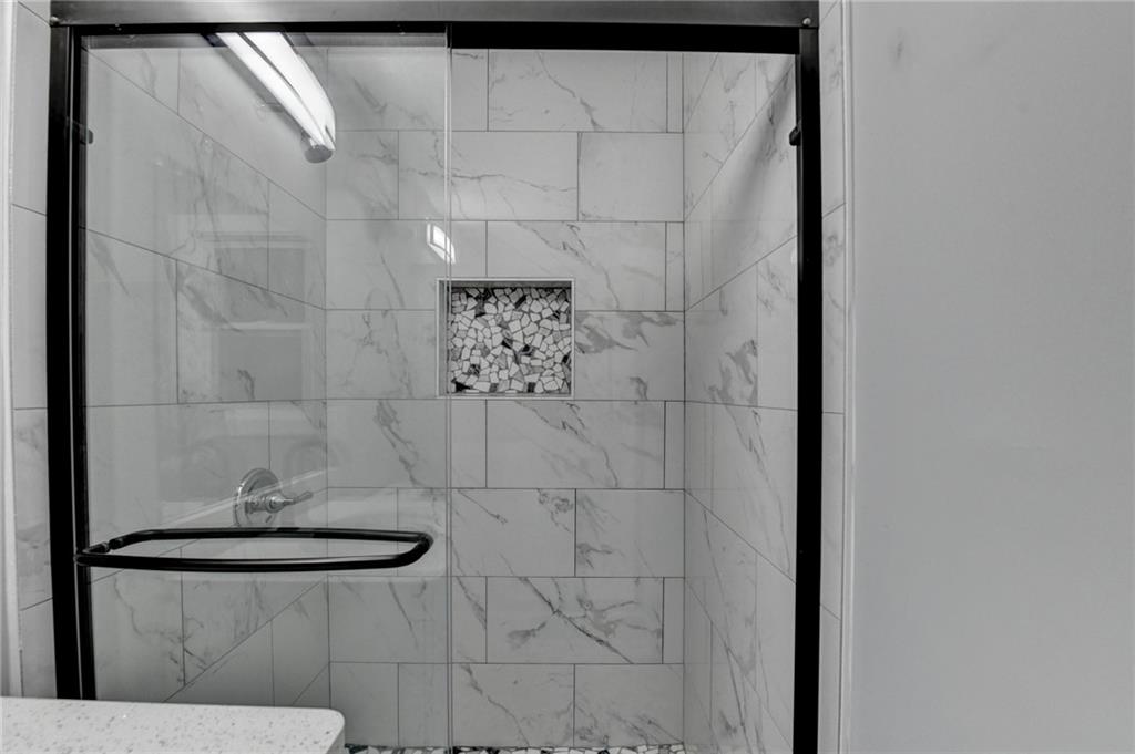 5169 Oxbow Road Stone Mountain, GA 30087 - Photo 44 of 58 a bathroom with a shower