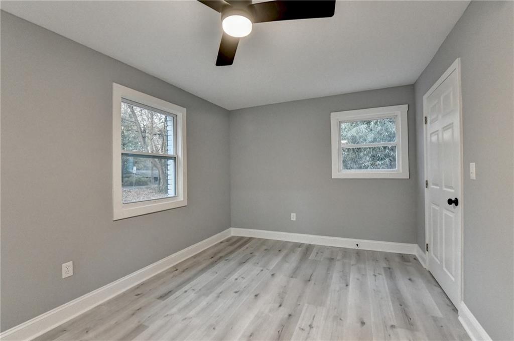 5169 Oxbow Road Stone Mountain, GA 30087 - Photo 50 of 58 a view of room with hardwood floor and window