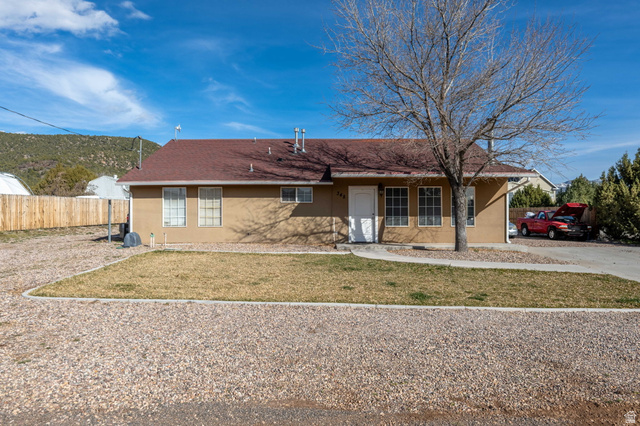 348 North Lodge Road Central, UT 84722 - Photo 2 of 25 Ranch-style house with stucco siding and a porch