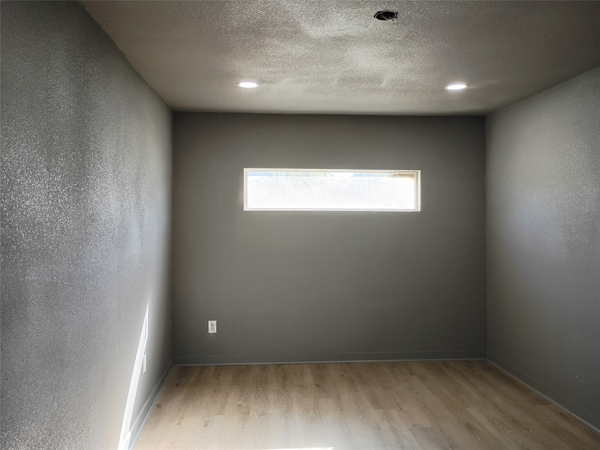 5617 Malmedy Road Houston, TX 77033 - Photo 6 of 12 an empty room with a window